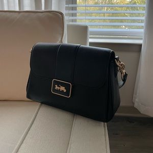 Black coach leather shoulder bag with gold clasp